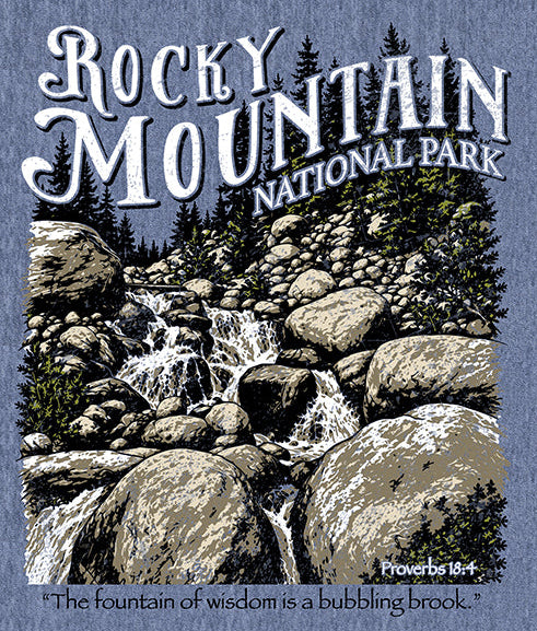 Rocky Mountain National Park t-shirt design mockup on a heathered blue fabric background, featuring a large scenic print and two smaller views of the front and back of a heathered blue crewneck t-shirt with the park logo.