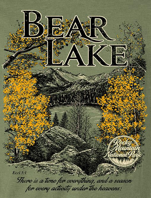 An olive green graphic t-shirt featuring a scenic illustration of Bear Lake National Park with yellow autumn trees, shown alongside front and back views of the shirt.